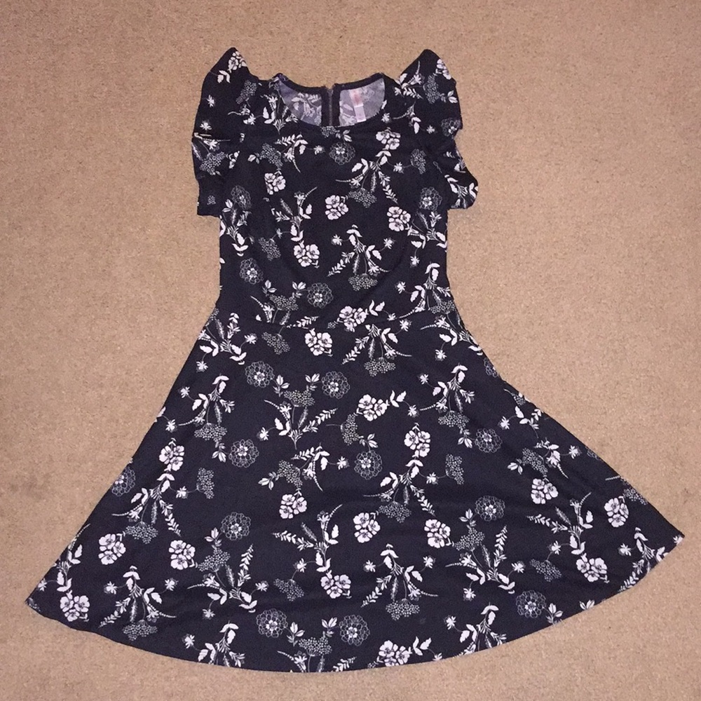Black dress with white designed flowers